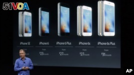 Greg Joswiak, vice president of iOS, iPad and iPhone product marketing, announces the new iPhone SE at Apple headquarters Monday, March 21, 2016, in Cupertino, Calif. (AP Photo/Marcio Jose Sanchez)