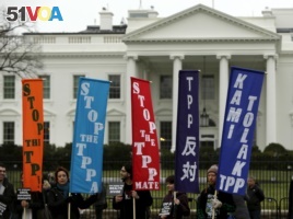 Opponents of the Trans Pacific Partnership (TPP) trade agreement protest outside the White House in Washington, Feb. 3, 2016.