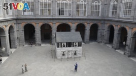 The house of U.S. civil rights campaigner Rosa Parks, rebuilt by artist Ryan Mendoza, is on display in the courtyard of an 18th century Royal Palace, in Naples, Italy, Tuesday, Sept. 15, 2020. (AP Photo/Gregorio Borgia)