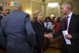 Democratic presidential candidate former Secretary of State Hillary Rodham Clinton shakes hands with House Select Committee on Benghazi chairman Rep. Trey Gowdy, R-S.C., at the conclusion of a hearing, on Capitol Hill on Thursday, Oct. 22, 2015