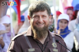 FILE - Chechnya's regional leader Ramzan Kadyrov smiles while visiting the Chechen State University in Chechnya's provincial capital Grozny, Russia, Thursday, Aug. 11, 2016.