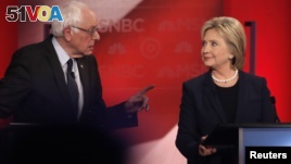 Democratic U.S. presidential candidate Senator Bernie Sanders (L) speaks directly to former Secretary of State Hillary Clinton as they discuss issues during the Democratic presidential candidates debate at the University of New Hampshire. Many noted the tone of the debate had sharpened.