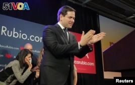 U.S. Republican presidential candidate Marco Rubio applauds as he approaches the podium to speak to supporters at a South Carolina primary night rally in Columbia, S.C., Feb. 20, 2016.