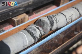 This March 1, 2017 photo, shows sections of a rock core extracted during a geological research project in the al-Hajjar mountains of Oman.