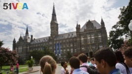 n this July 10, 2013, file photo, prospective students tour Georgetown University's campus in Washington.