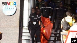 A body is removed from the Radisson Blu hotel, after it was stormed by gunmen during a attack on the hotel in Bamako, Mali, Friday, Nov. 20, 2015. Islamic extremists armed with guns and grenades stormed the luxury Radisson Blu hotel in Mali's capital Friday morning, and security forces worked to free guests floor by floor.  (AP/Harouna Traore)