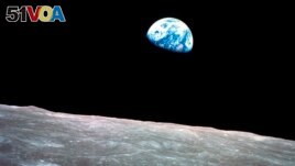 FILE - This Dec. 24, 1968, file photo made available by NASA shows the Earth behind the surface of the moon during the Apollo 8 mission. (William Anders/NASA via AP, File)