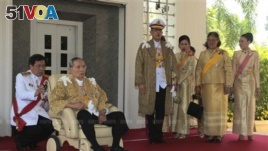 This photo released by Thailand's Royal Household Bureau shows Thai King Bhumibol Adulyadej, second from left, along with Crown Prince Vajiralongkorn, third from left, Princess Chulabhorn, Princess Sirindhorn, and Consort Princess Srirasm.