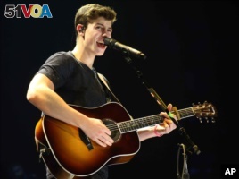 Shawn Mendes performs as the opener for Taylor Swift during The 1989 World Tour at the Georgia Dome on Oct. 24, 2015, in Atlanta. 