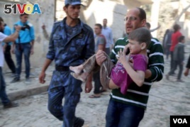 A child injured in a bombing in Syria is rushed to medical help.