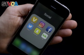 FILE - Some social media apps on a smartphone.