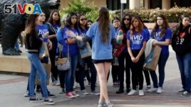 FILE - High school students visit UCLA in 2015. Most colleges permitted visitors this year. (AP Photo/Damian Dovarganes, File)