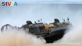 A US Navy hovercraft approaches the beach at the beginning of the NATO Trident Juncture exercise 2015 at Raposa Media beach in Pinheiro da Cruz, south of Lisbon, Oct. 20, 2015.