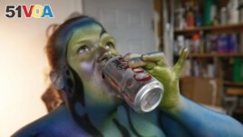 FILE - A person with airbrushed body paint.