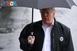 U.S. President Donald Trump talks to reporters from the White House in Washington, October 15, 2018 before leaving for Florida to inspect hurricane damage there.