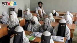 FILE - Afghan girls of all ages are permitted to study in religious schools, which are traditionally boys-only, a Taliban official said Thursday Dec. 21, 2023. (AP Photo/Ebrahim Noroozi, File)