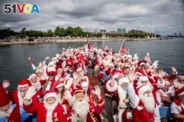 People dressed as Santa Claus take part in the World Santa Claus Congress, an annual event held every summer in Copenhagen, Denmark, July 23, 2018. (Ritzau Scanpix/Mads Claus Rasmussen)
