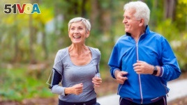 An older couple couple jogging in the park. (Getty Images)