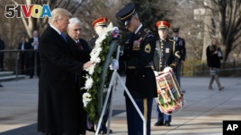 President-elect Donald Trump places a wreath at the Tomb of the Unknowns, Thursday, Jan. 19, 2017, at Arlington National Cemetery in Arlington, Va., ahead of Friday's presidential inauguration. (AP Photo/Evan Vucci)
