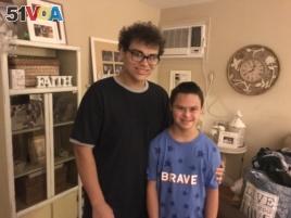 Jason Piccolomini, left, and his brother Brandon, right, at their home in Staten Island, NY. Jason leaves for his first-year of college this weekend.
