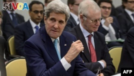 US Secretary of State John Kerry (L) takes part in talks with P5+1 ministers, European Union and Iranian minister on Iran nuclear talks at the Beau Rivage Palace Hotel in Lausanne, Switzerland, March 31, 2015. Negotiations there helped establish a framework for the current negotiations.