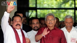 Gotabaya Rajapaksa, Sri Lanka People's Front party presidential election candidate and former wartime defence chief, with his brothers, Mahinda Rajapaksa, former president and opposition leader and Chamal Rajapaksa (R) are seen as they leave after...