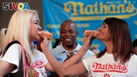 Does this include competitive eaters? Champion Miki Sudo (L) poses with competitor Michelle Lesco during the official weigh-in ceremony for the Nathan's Famous Fourth of July International Hot Dog-Eating Contest in Brooklyn, New York, July 1, 2016. (REUTERS/Andrew Kelly)
