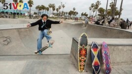 Expert skateboarder Di'Orr Greenwood, an artist born and raised in the Navajo Nation in Arizona and whose work is featured on the new U.S. stamps, exits the concrete bowl in the Venice Beach neighborhood in Los Angeles Monday, March 20, 2023. (AP Photo/Damian Dovarganes)