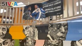 A mural at the Howard University bookstore in Washington, D.C., along with a banner celebrating graduate Kamala Harris.