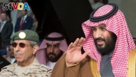 FILE - Saudi Arabia's Crown Prince Mohammed bin Salman gestures during the graduation ceremony of the 93rd batch of the cadets of King Faisal Air Academy, in Riyadh, Feb. 21, 2018. (Reuters)