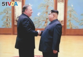 FILE - A U.S. government handout photo shows then-Central Intelligence (CIA) Director Mike Pompeo meeting with North Korean leader Kim Jong Un in Pyongyang, North Korea.