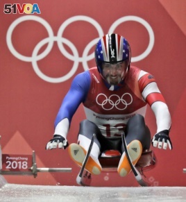 Chris Mazdzer of United States starts his first men's luge run at the 2018 Winter Olympics in Pyeongchang, South Korea, Saturday, Feb. 10, 2018. (AP Photo/Wong Maye-E)
