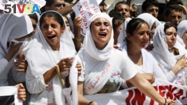 Yazidi Kurdish women chant slogans during a protest against the Islamic State group's invasion of Sinjar city in Dohuk, northern Iraq. (File)