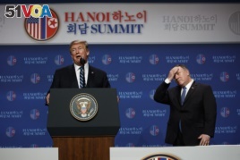 President Donald Trump speaks as Sec of State Mike Pompeo looks on during a news conference after a summit with North Korean leader Kim Jong Un, Thursday, Feb. 28, 2019, in Hanoi. (AP Photo/ Evan Vucci)
