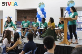 Student leaders and a professor at Duke University lead a presentation sharing information new international students will need.