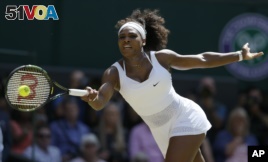 Serena Williams of the United States returns a shot to Garbine Muguruza of Spain, during the women's singles final at Wimbledon, London, Saturday July 11, 2015. (AP Photo/Kirsty Wigglesworth)