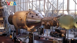 A display at the Smithsonian Air and Space Museum depicts the docking of an American Apollo command and service module, left, with a Soviet Soyuz capsule, Sunday, Dec. 7, 2014 in Washington, D.C. The July 1975 docking was part of a 1972 agreement between