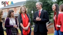 North Carolina State University Dean Jeff Braden shares a laugh with students after a class.