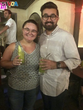 Cat Tjan, 27, and Ammar Farooqi, 26, drink mocktails.