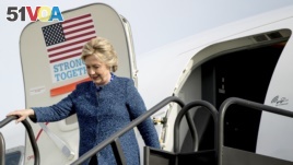 Democratic presidential candidate Hillary Clinton arrives at Eastern Iowa Airport in Cedar Rapids, Iowa, Friday, Oct. 28, 2016. 
