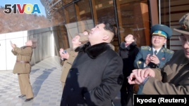 North Korean leader Kim Jong Un watches a long range rocket launch into the air in North Korea, in this photo released by Kyodo, Feb. 7, 2016.  (REUTERS/Kyodo)