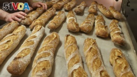 FILE - Baguettes are seen as they come out of the oven of the bakery La Parisienne in Paris, Friday, March 18, 2016. The bread has been recognized by UNESCO.
(AP Photo/Michel Euler/File photo)