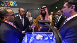Saudi Crown Prince Mohammed bin Salman view a showing of Saudi Arabian technology, including an exhibit by King Abdullah University of Science and Technology, during a visit to Massachusetts Institute of Technology on Saturday, March 24, 2018.