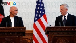 Afghanistan's president Ashraf Ghani, left, and U.S. Defense Secretary James Mattis, right, attend a news conference in Kabul, Afghanistan, Sept. 27, 2017.