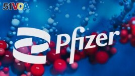 FILE: The Pfizer logo is displayed at the company's headquarters in New York, on Feb. 5, 2021. 