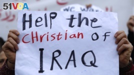An Iraqi Christian who lives in Lebanon holds a placard during a sit-in, in front of the United Nations. (File)