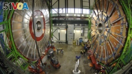 FILE - Overview of the first element (L) of the huge magnet of the CMS (Compact Muon Solenoid) experimental site at the European Organization for Nuclear Research CERN (Centre Europeen de Recherche Nucleaire) before its lowering on Thursday in the French village of Cessy in 2006.