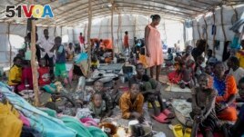 South Sudanese shelter in a transit center in Renk, South Sudan Wednesday, May 17, 2023. (AP Photo/Sam Mednick)