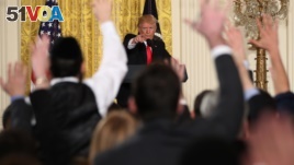 President Donald Trump calls on a reporter during a news conference in the East Room of the White House in Washington, Feb. 16, 2017. Eager to improve U.S.-Russian relations before he got elected, Trump said at the news conference 