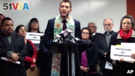 The Rev. Noel Andersen, center, from the Church World Service, condemns the alleged raids of Central American families with final order of deportation, on Tuesday, Dec. 29, 2015, at the headquarters of the Coalition for Humane Immigrant Rights of Los Angeles, in Los Angeles. Religious leaders and pro-immigration activists demanded president Barack Obama to stop the alleged raids. (AP Photo/Edwin Tamara)